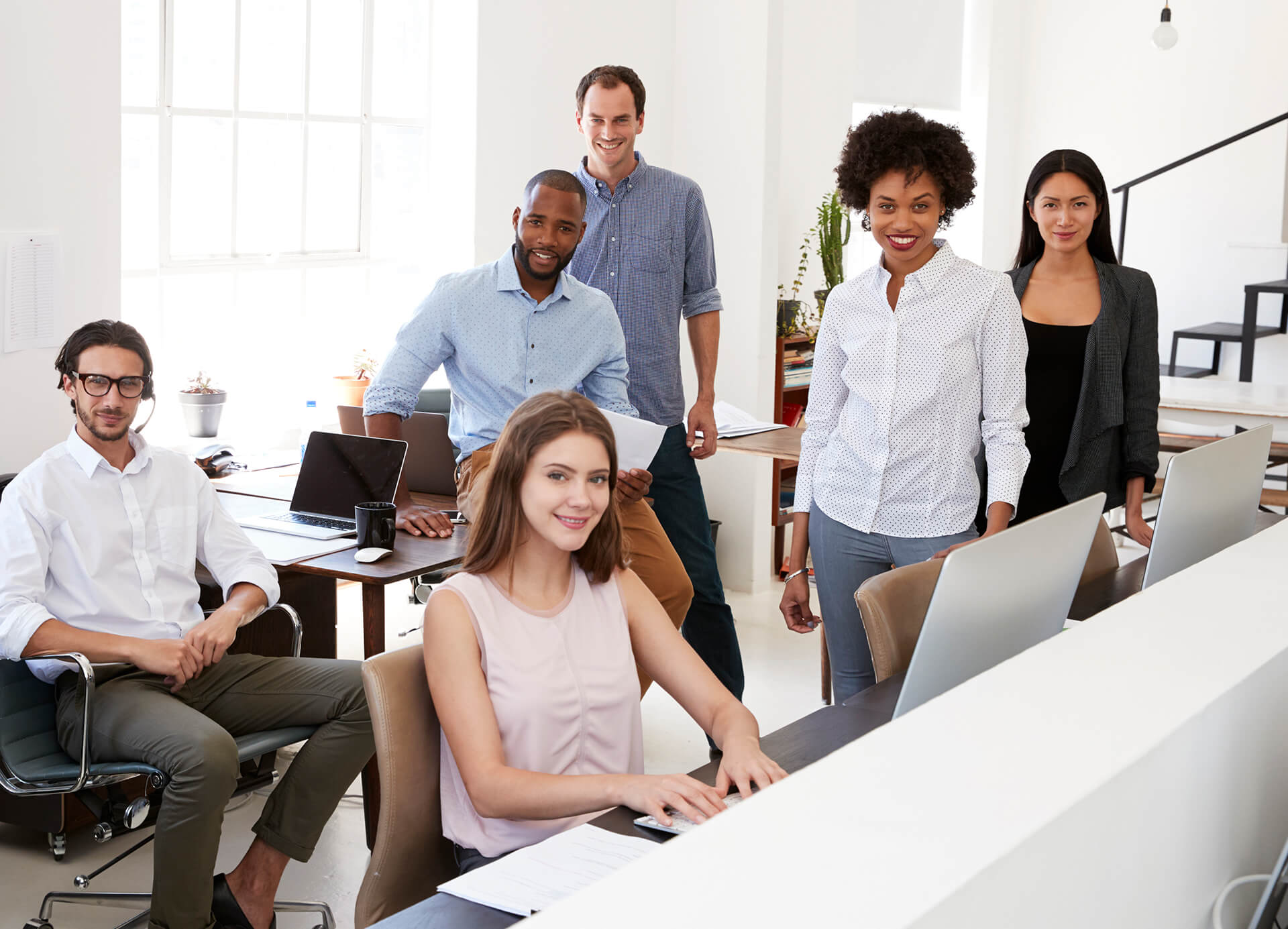 young-business-colleagues-smiling-to-camera-in-the-PRXFB7E.jpg